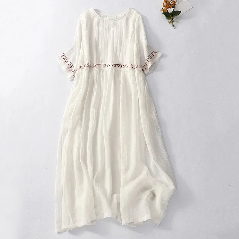 White cotton-linen midi dress with boho embroidery, flat lay