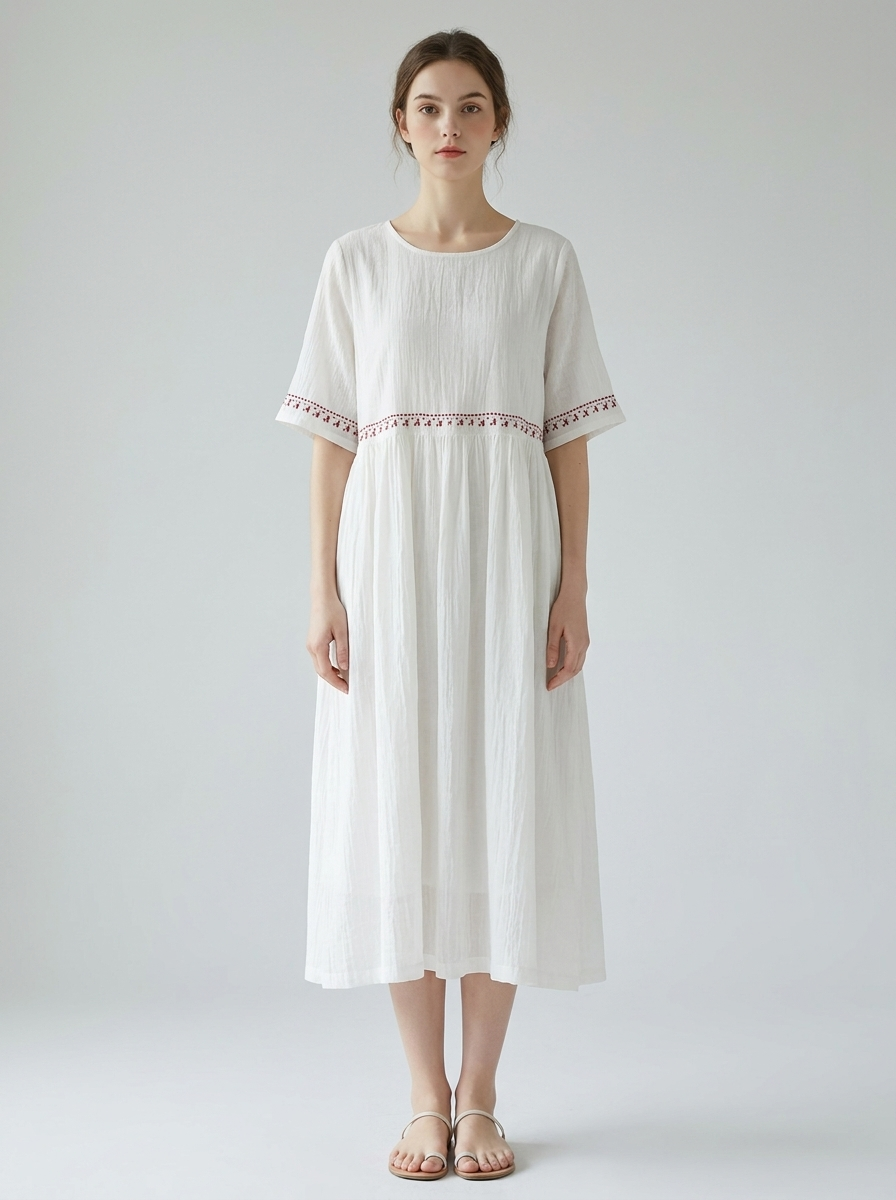 Maribel embroidered cotton-linen midi dress in white, model front view
