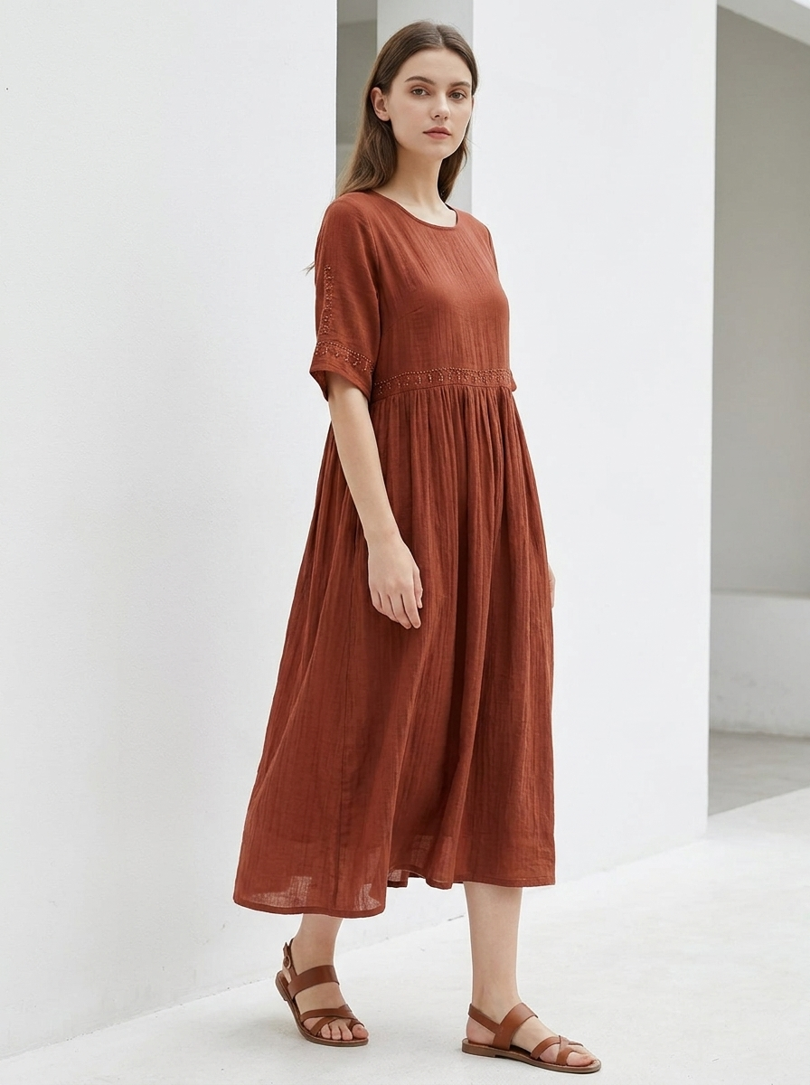 Maribel embroidered cotton-linen midi dress in brown, model three-quarter view