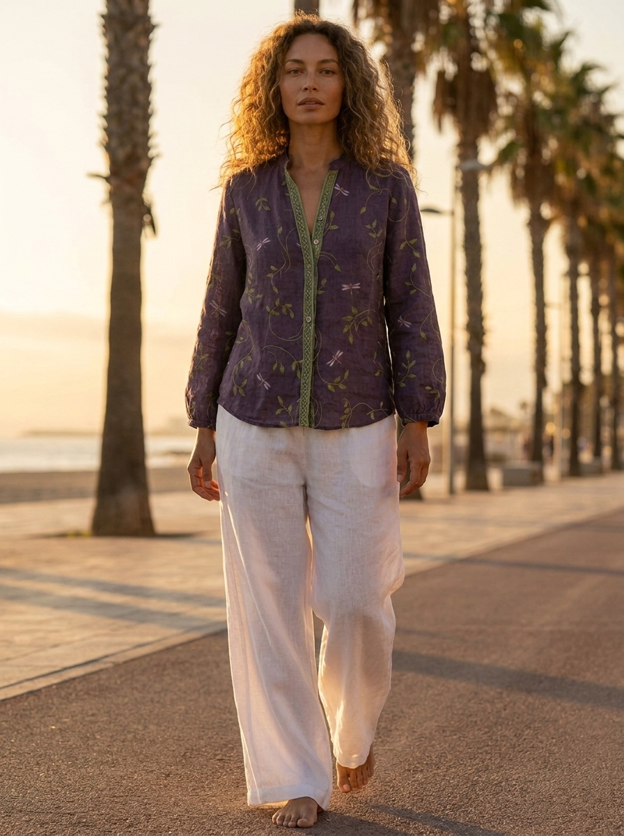Cosette boho linen blouse on a golden-hour seaside boulevard