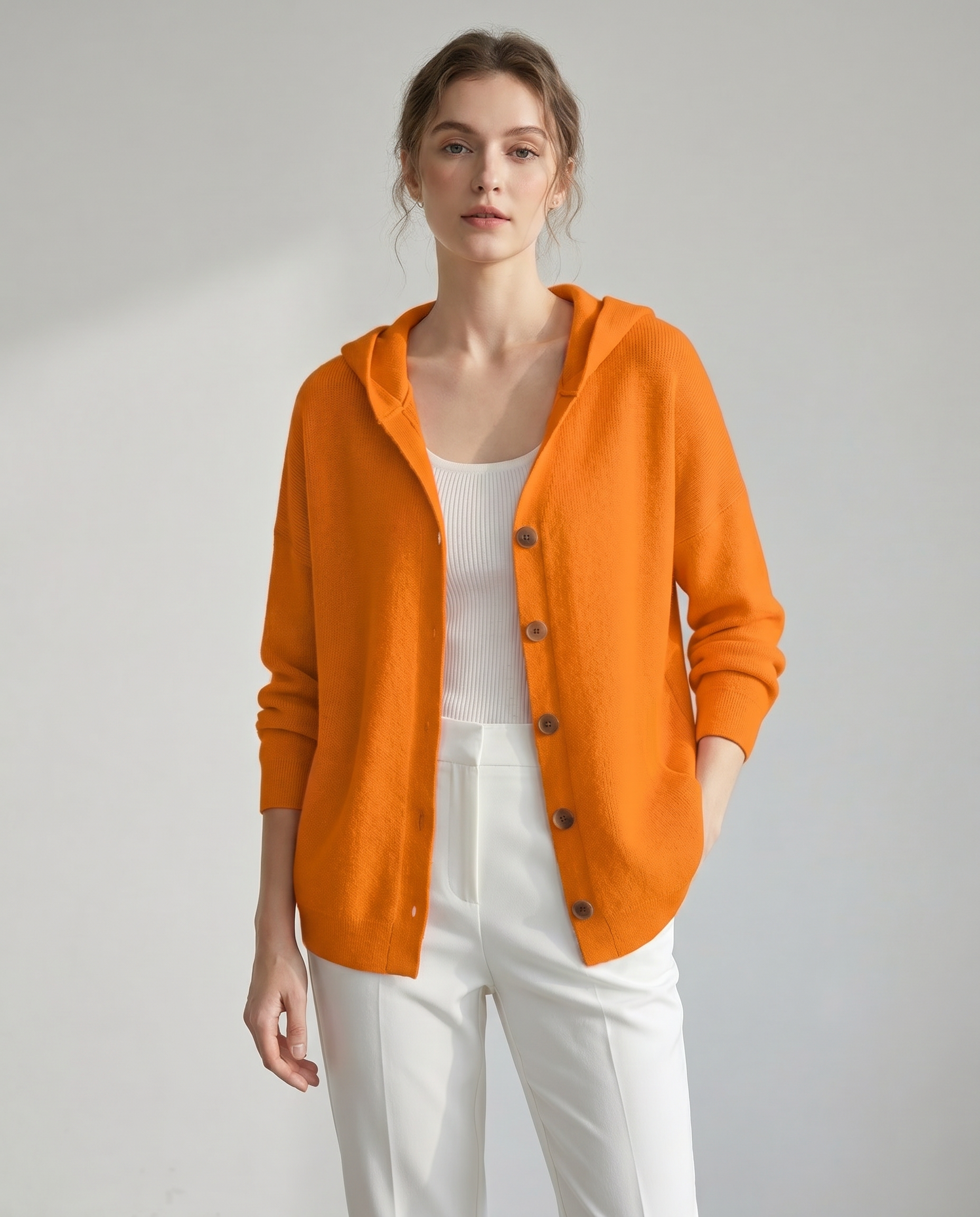 Lucille hooded button-front knit cardigan in orange, studio front view
