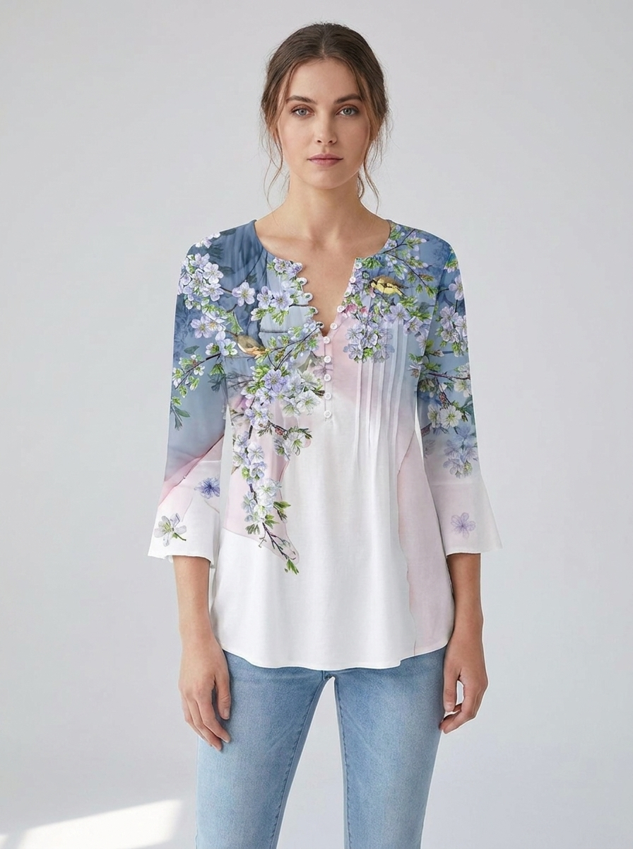Blue-and-white ombre henley blouse with cherry-blossom print, front view