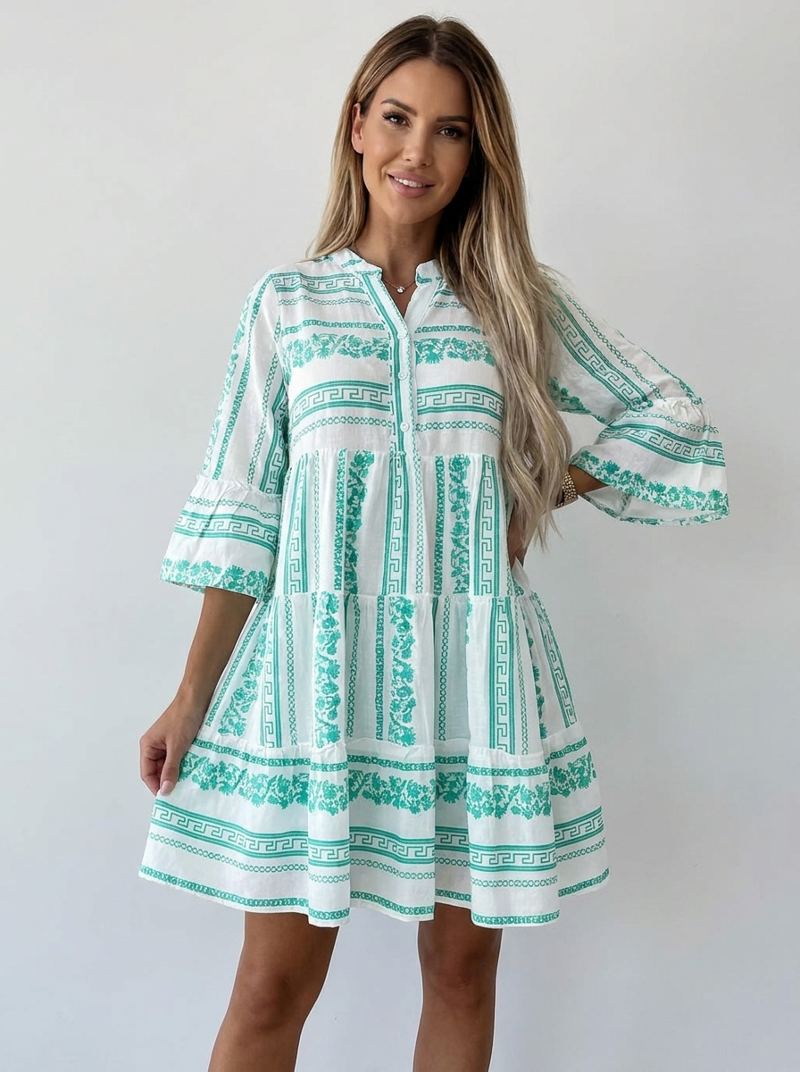 Aveline boho tiered floral mini dress in green Greek-key print, front studio view