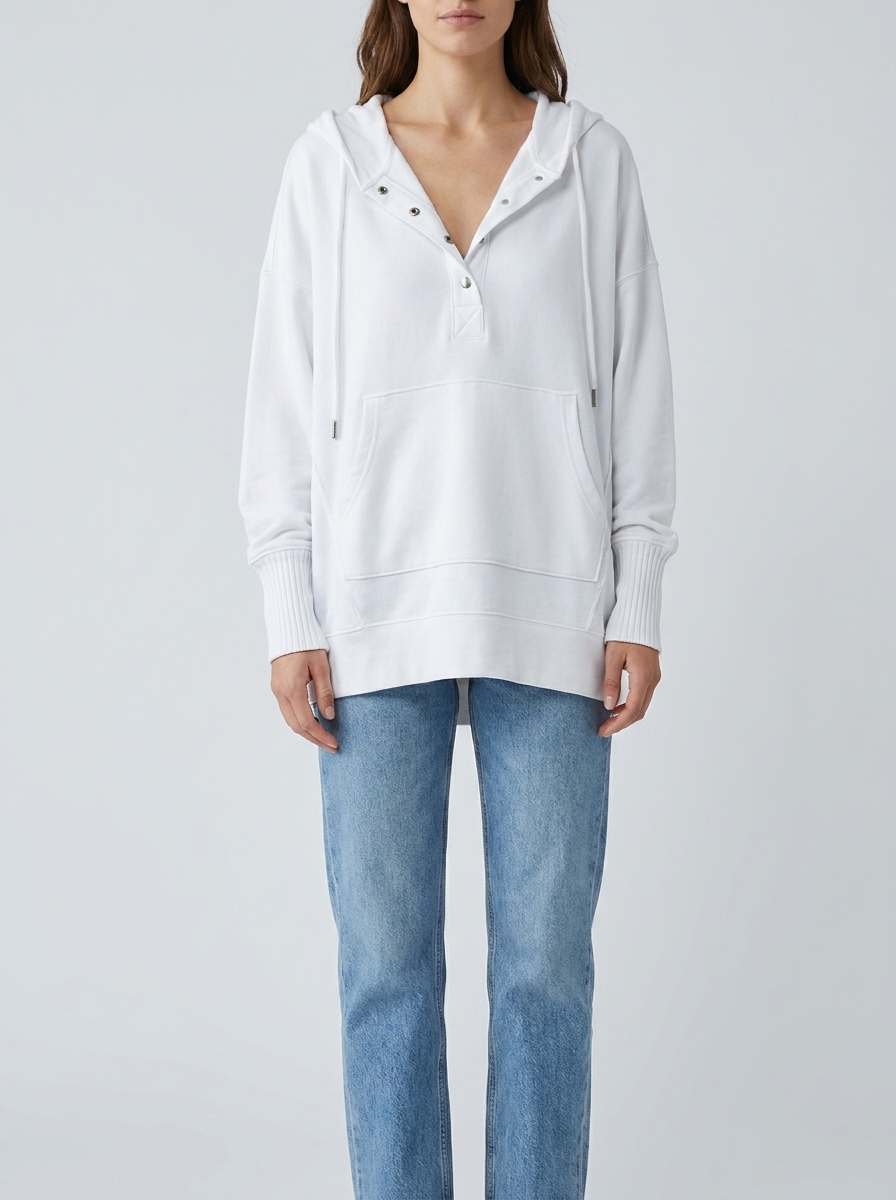 Woman wearing white oversized hooded drawstring tunic top with jeans