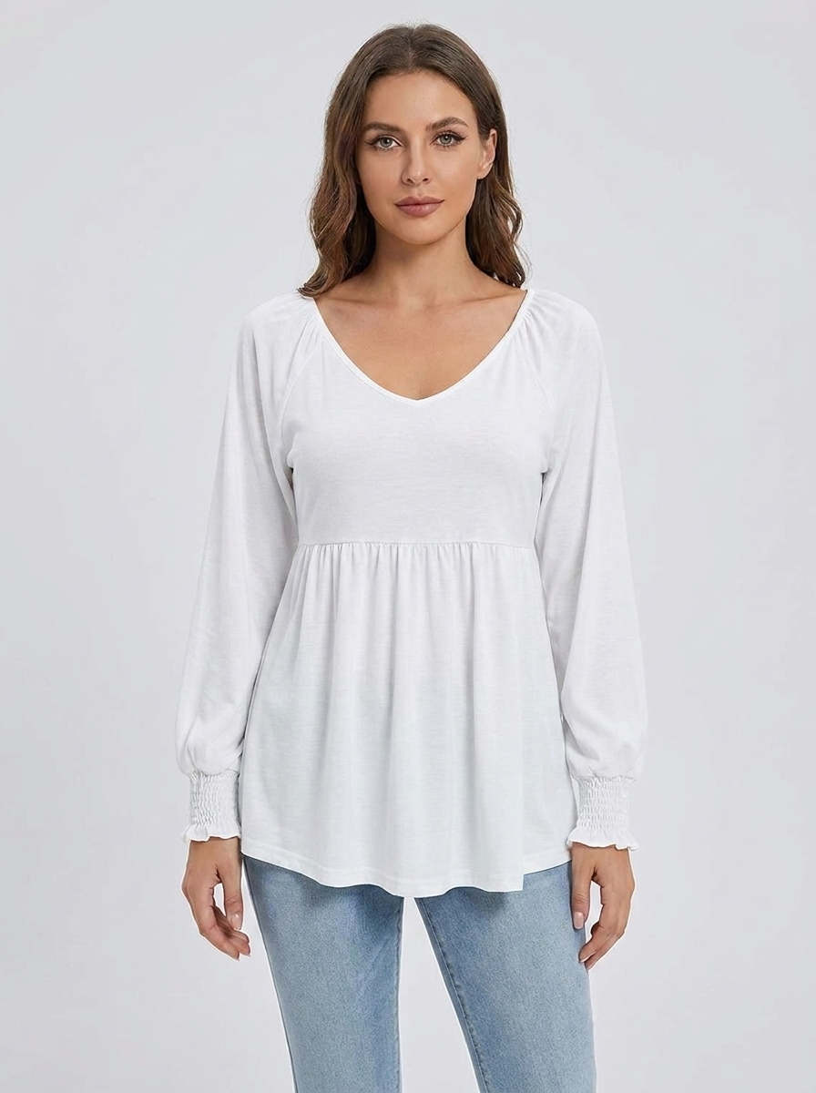 Women's white babydoll V-neck long-sleeve smocked-cuff tunic, front studio view