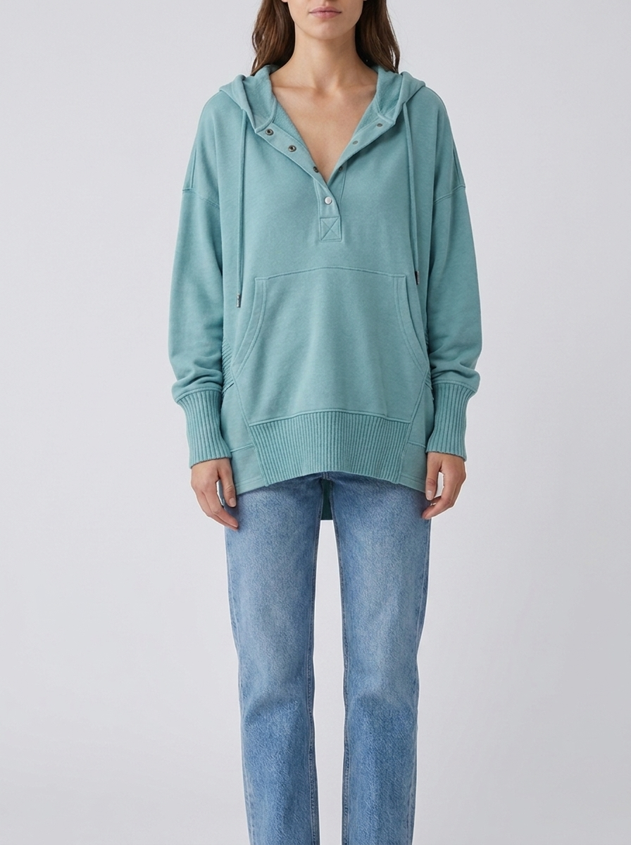 Woman wearing light blue oversized hooded drawstring tunic top