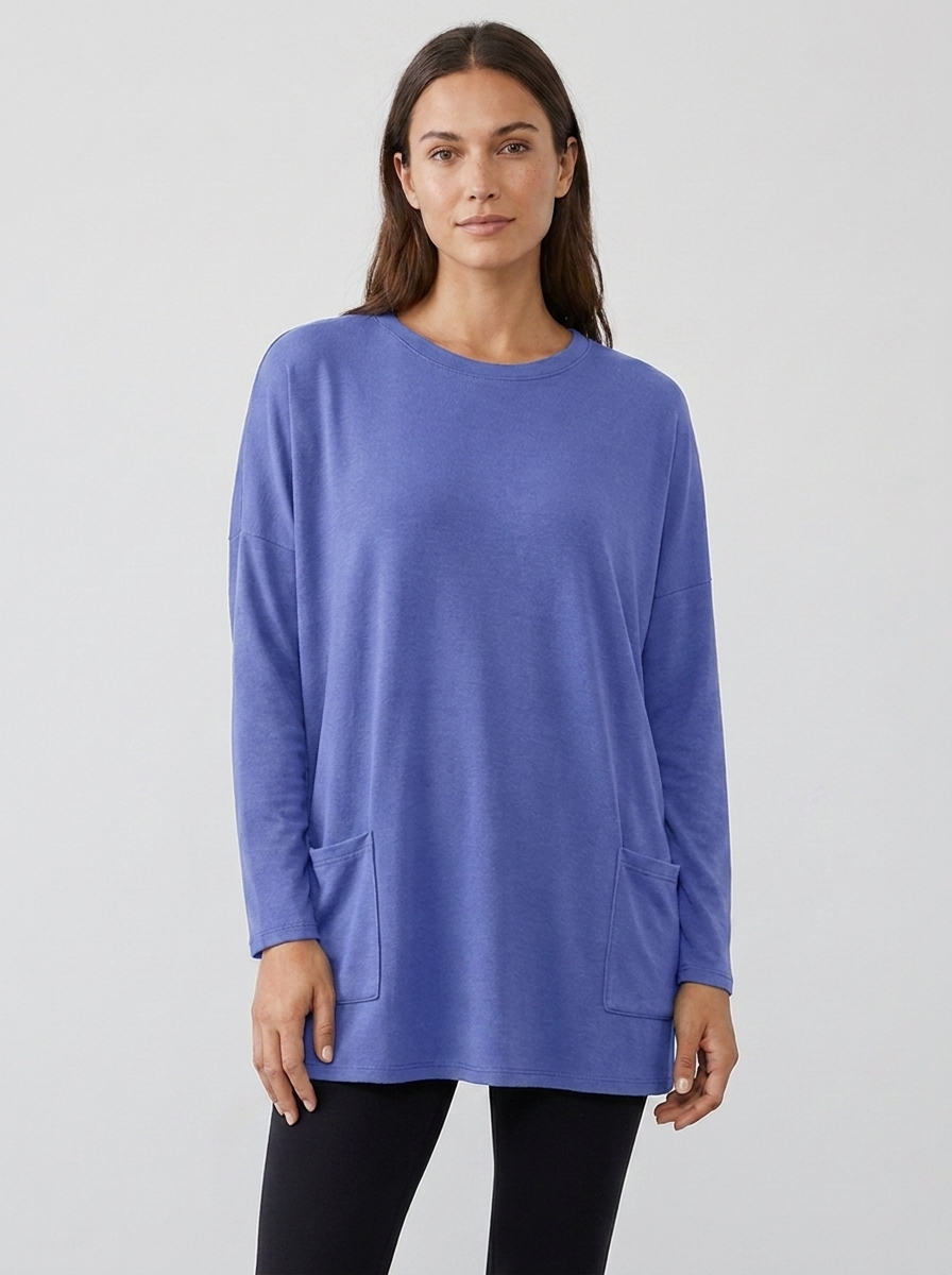 Women's oversized long-sleeve pocket tunic top in blue, front view