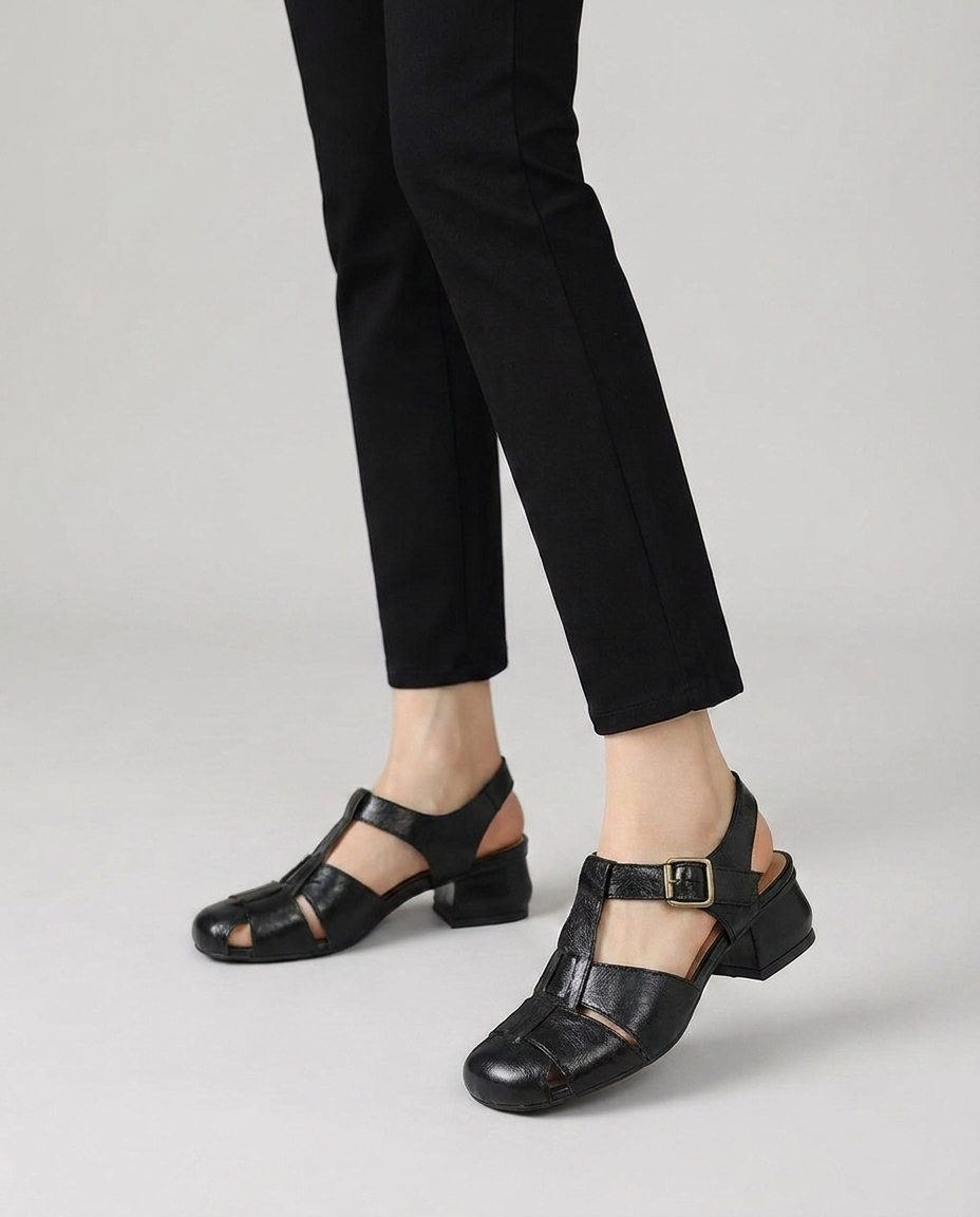 Women's caged leather closed toe block heel slingbacks in black, on-foot editorial studio