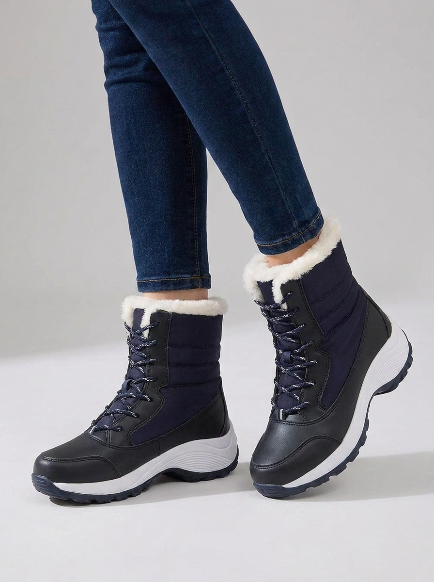 Ghislaine women's navy blue fur-lined waterproof snow boots on foot