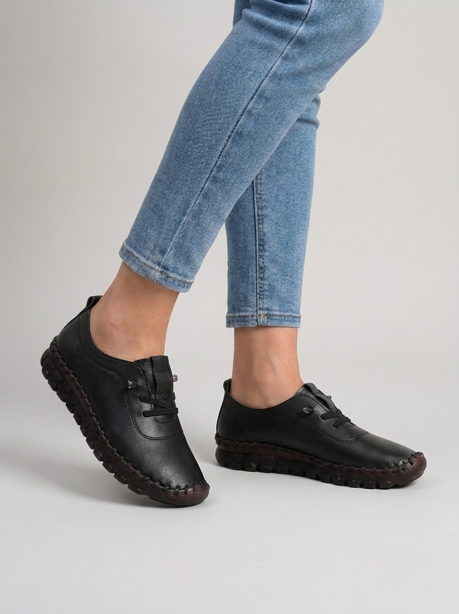 Women's black hand-stitched leather slip-on casual sneakers, studio