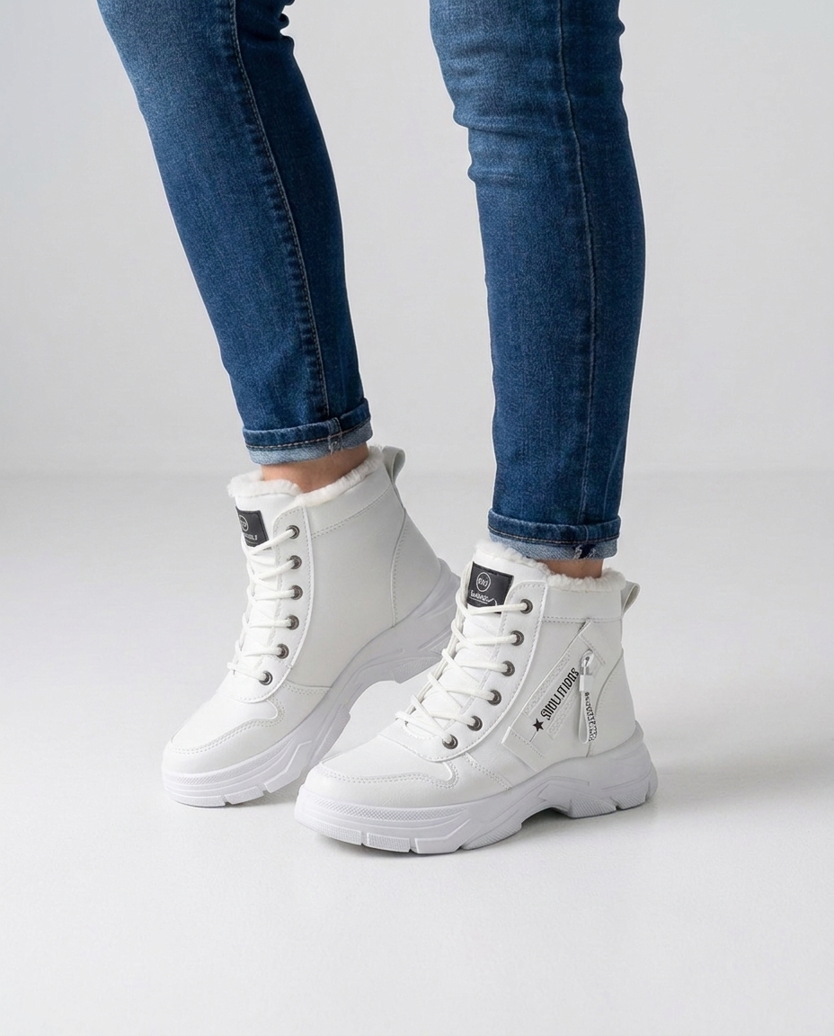 Women's white fur-lined lace-up winter boots on foot