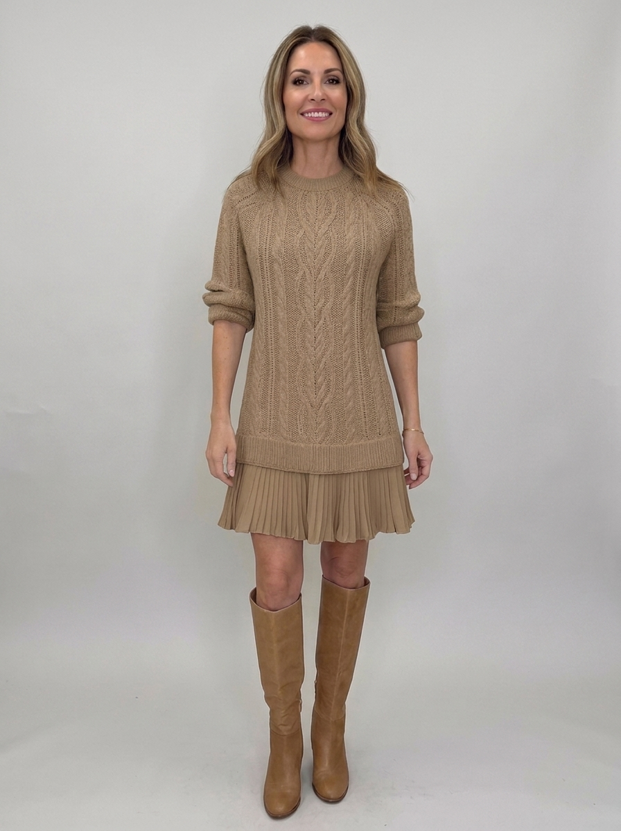 Woman wearing camel brown cable-knit sweater mini dress with pleated ruffle hem