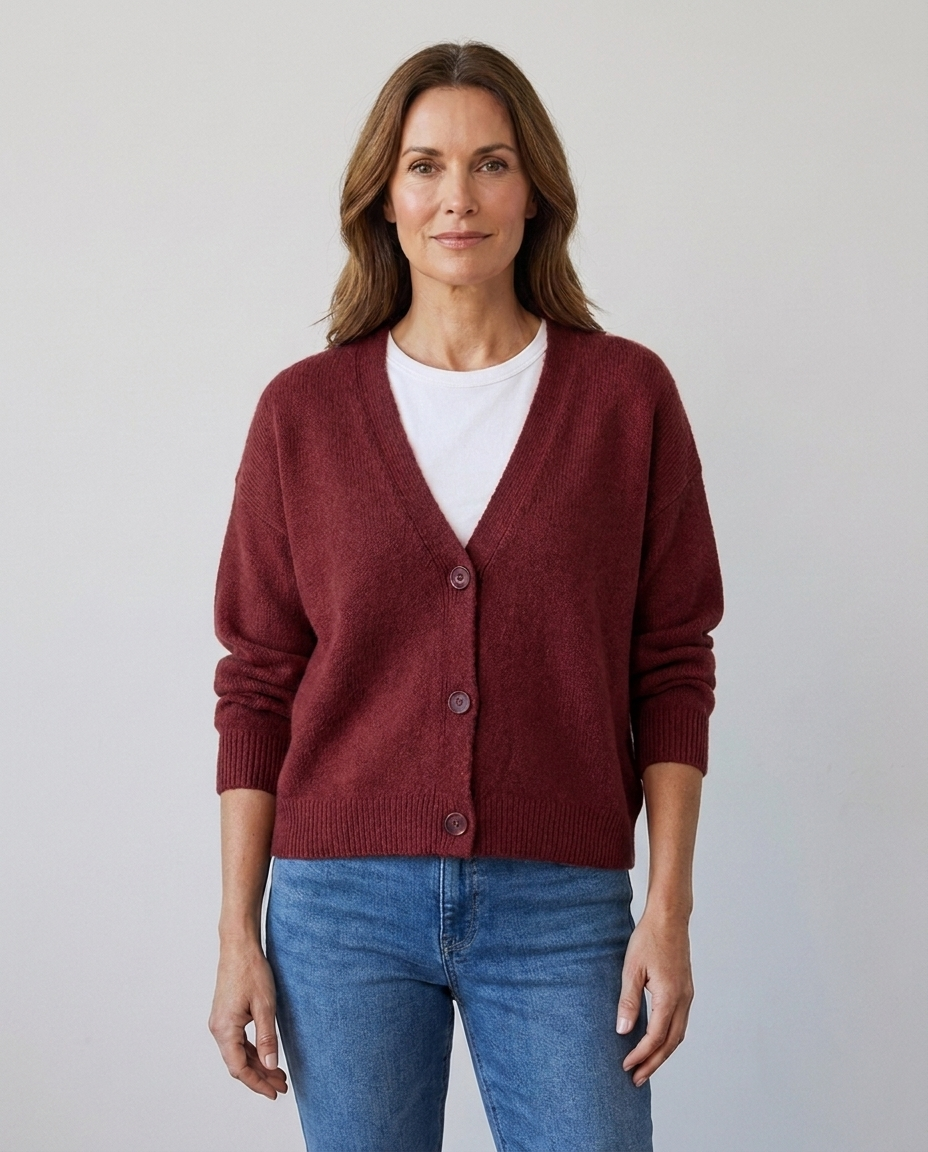 Women's relaxed knit button-front V-neck cardigan in maroon, worn over a white tee with jeans