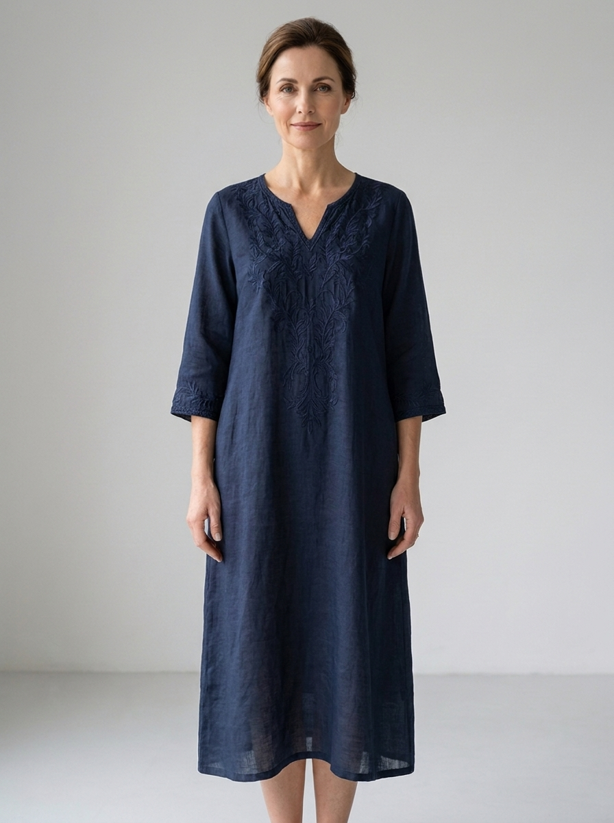Woman wearing navy embroidered cotton-linen midi tea party dress, front view
