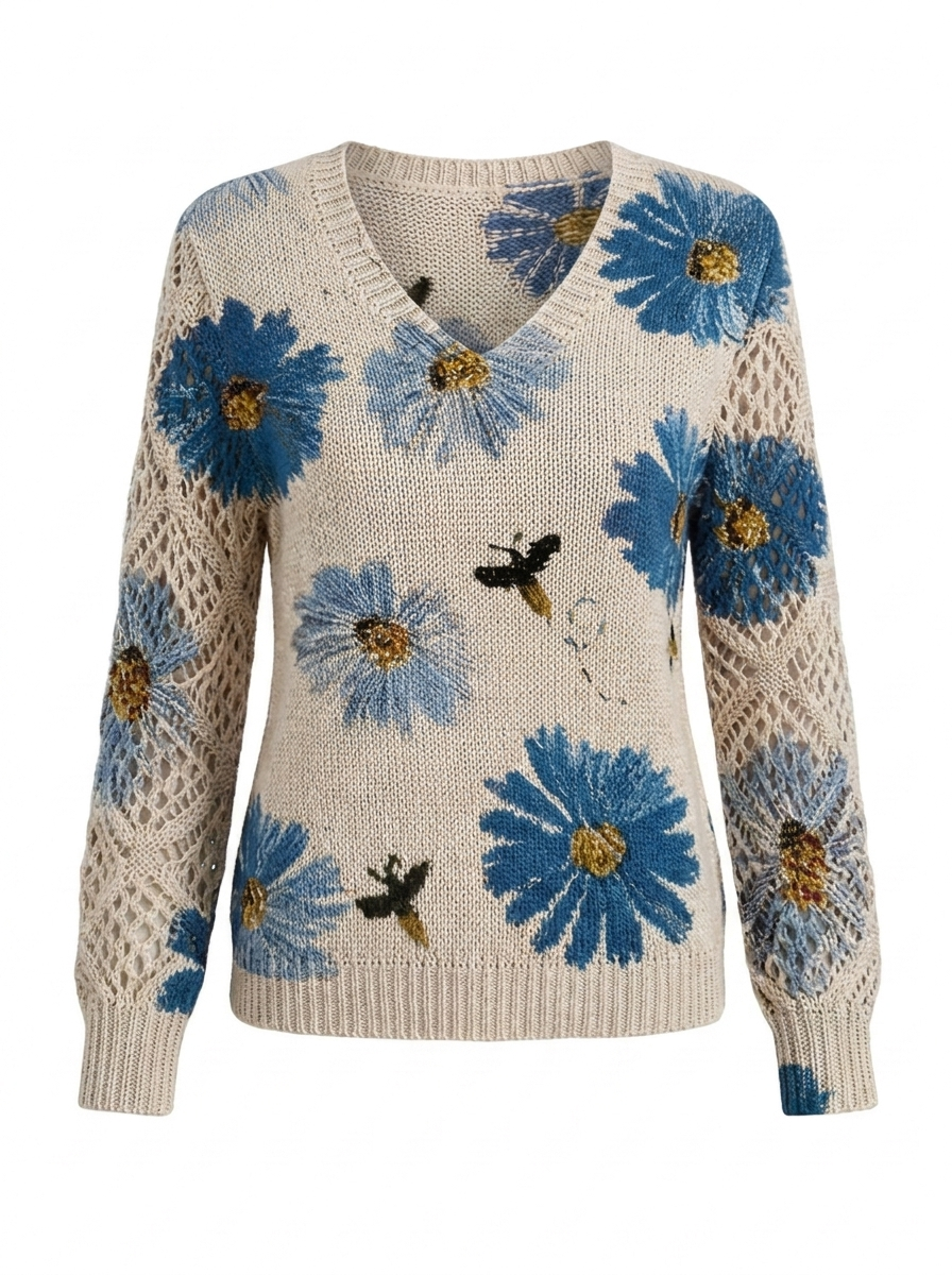 Women's floral knit V-neck sweater in cream with blue daisies and open lattice sleeves
