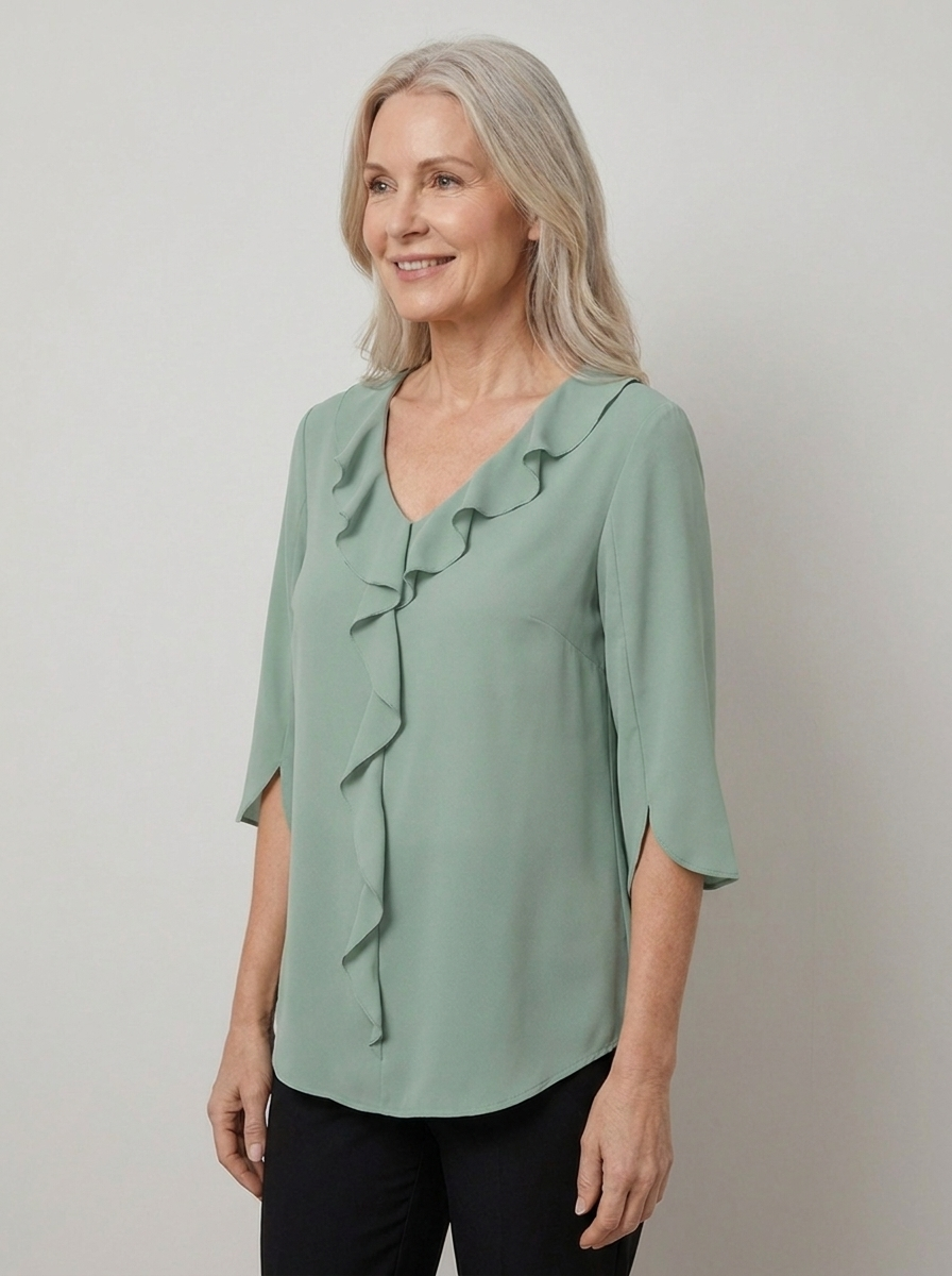 Marceline ruffle V-neck chiffon blouse in green on model, three-quarter