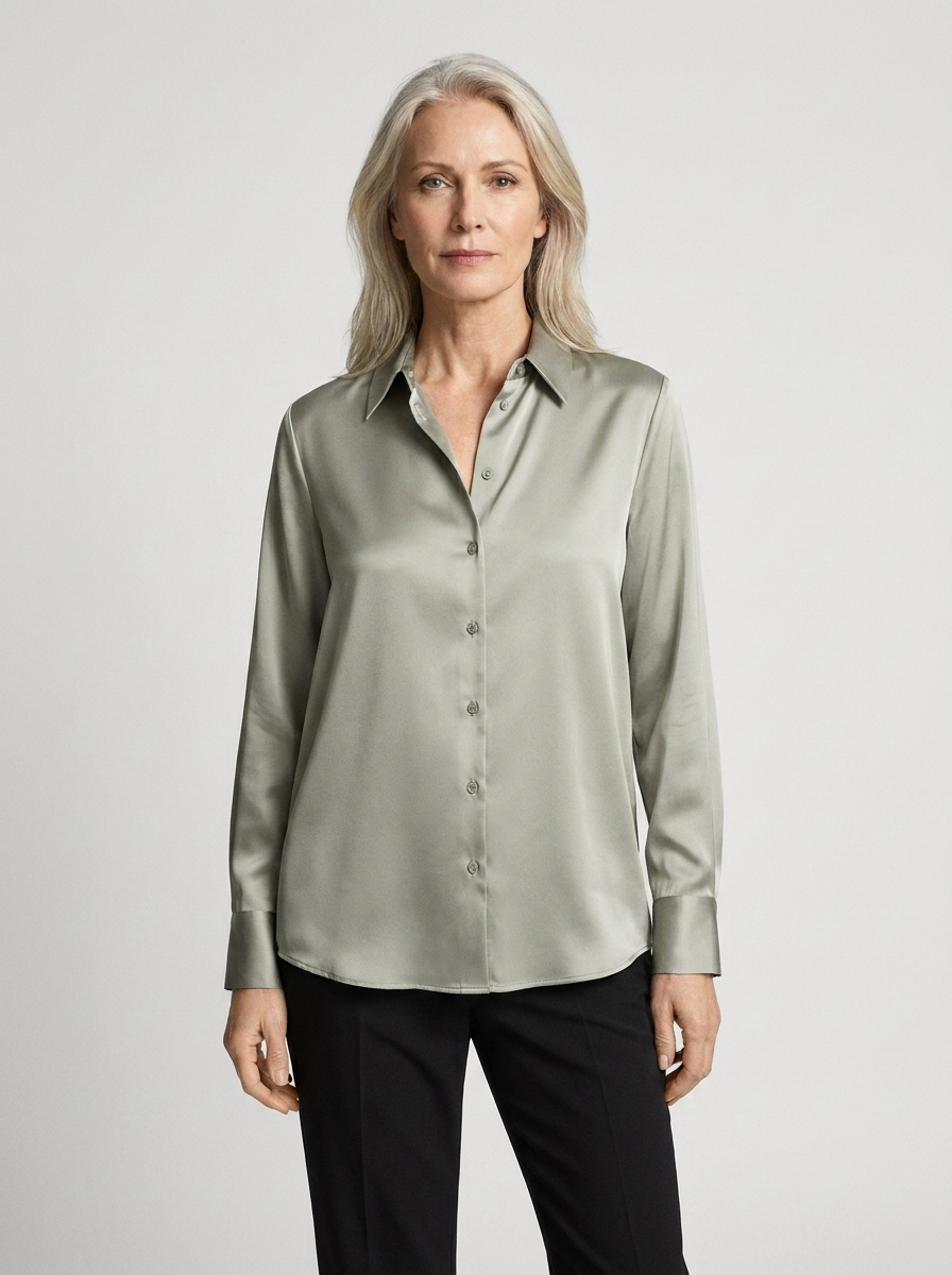 Woman wearing green satin blouse front