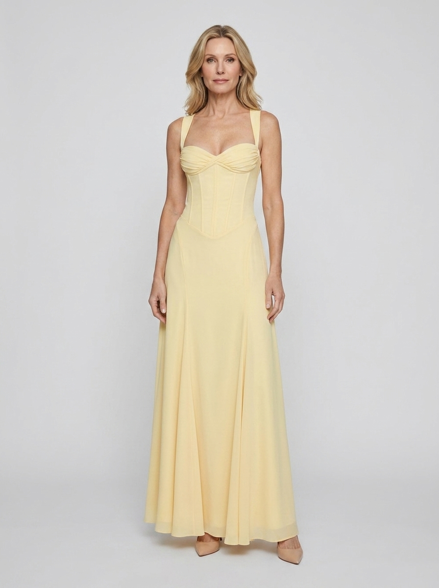 Loretta yellow maxi wedding guest dress on model front
