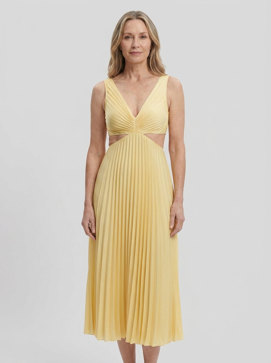 Woman wearing Maren yellow pleated cutout dress, front