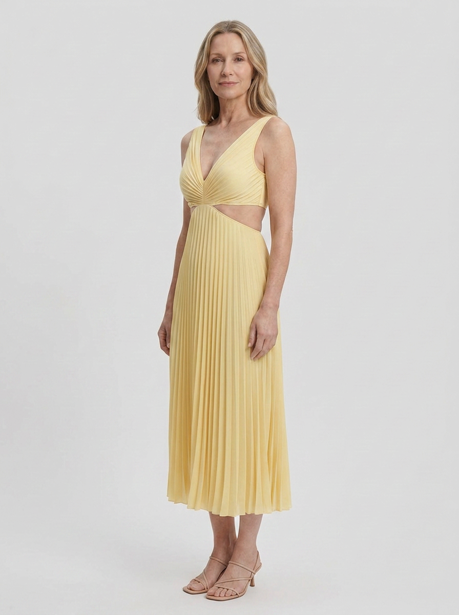 Woman wearing Maren yellow pleated cutout dress, three-quarter